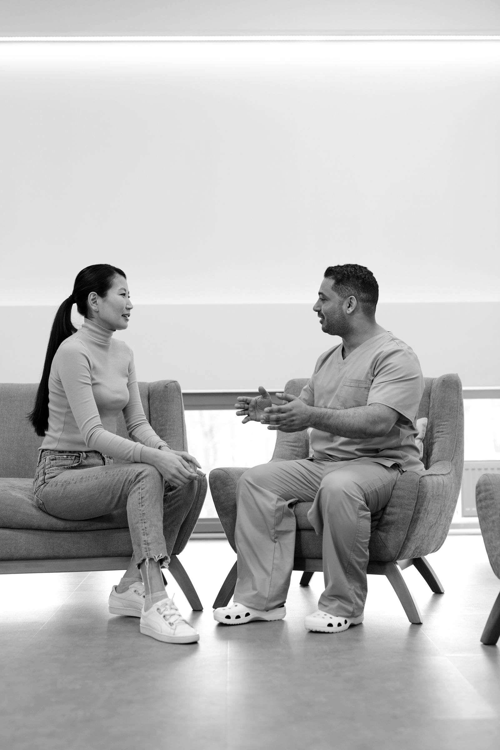 Two people in a warm, unhurried healthcare conversation
