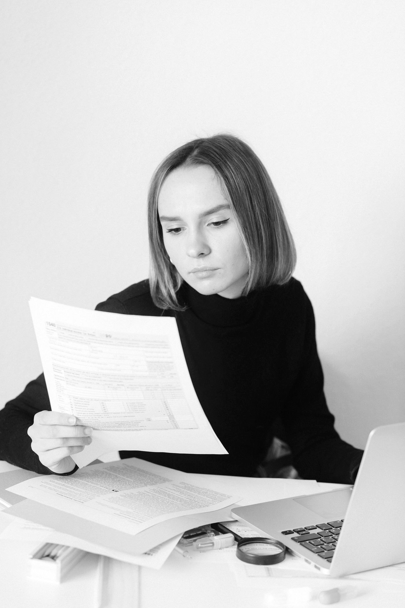 A person carefully reviewing their own medical paperwork