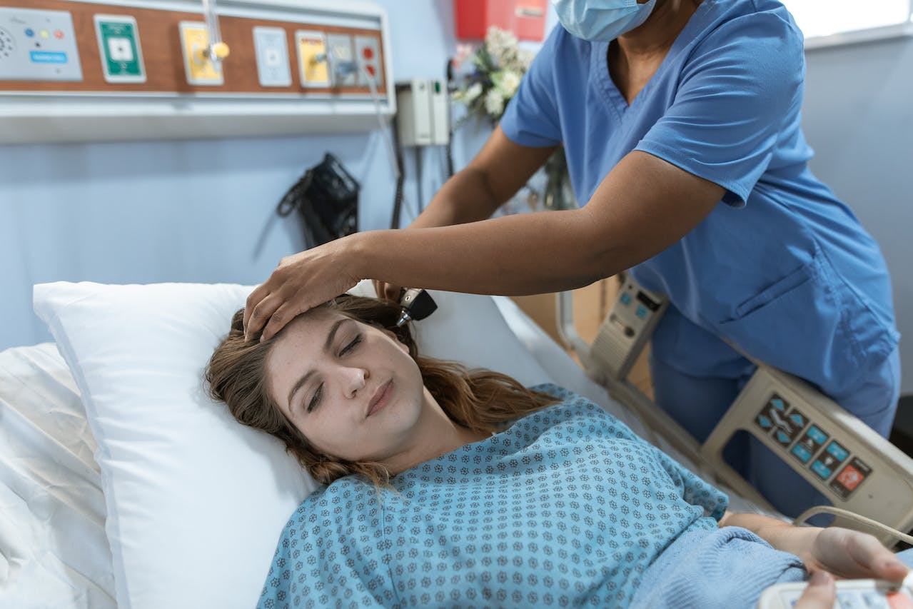 A nurse looking after a sick patient. 