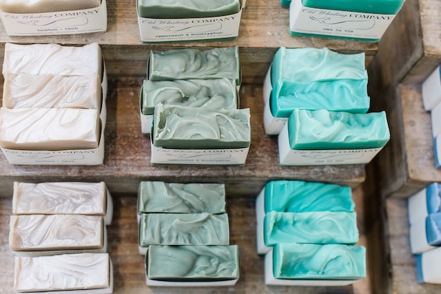 Soaps of various colors stacked neatly.