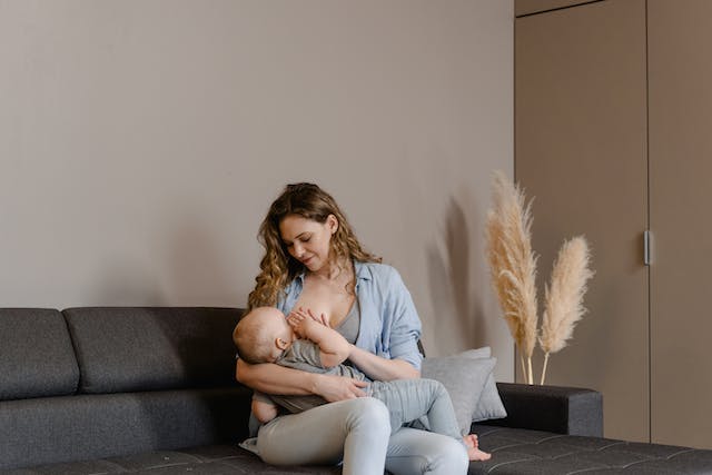 Mother breastfeeding a baby.