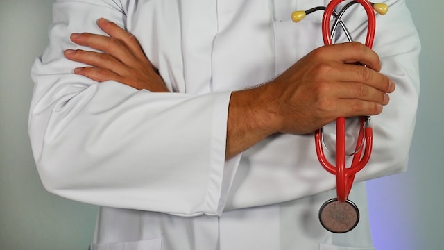 An image of a doctor holding stethoscope for IVF Testing. 