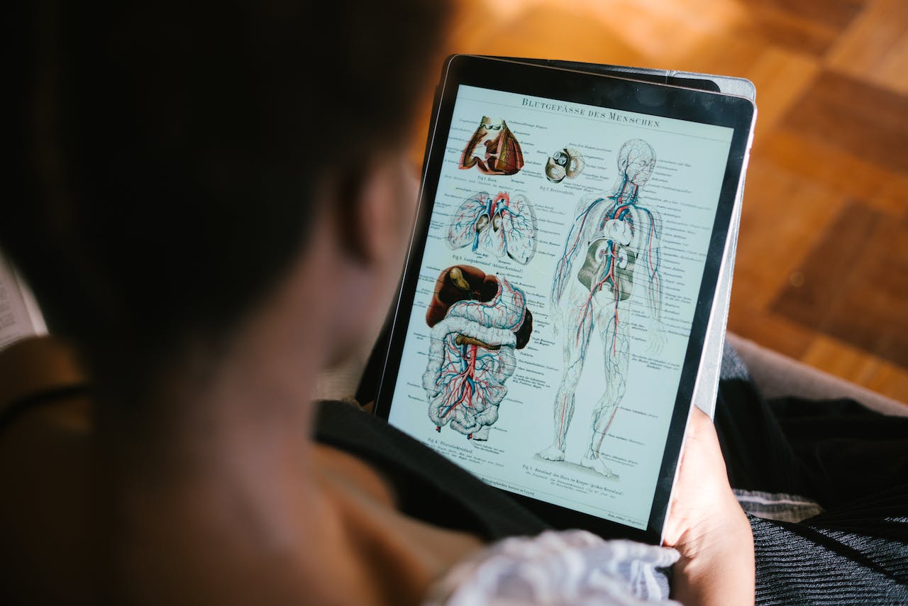 A man checking medical info on his tablet. 