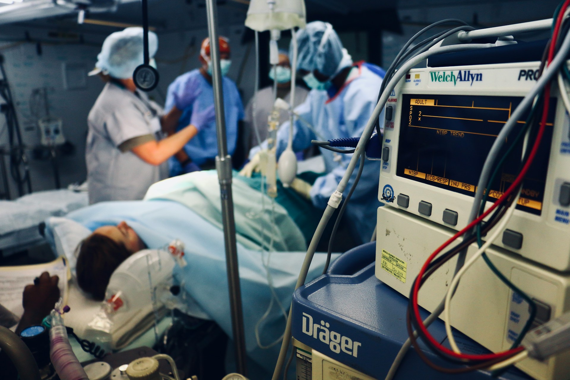 Doctors performing surgery on a patient. 
